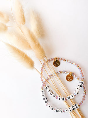 Stretchy beaded bracelet with "Kind Is My Vibe" slogan and colorful stones